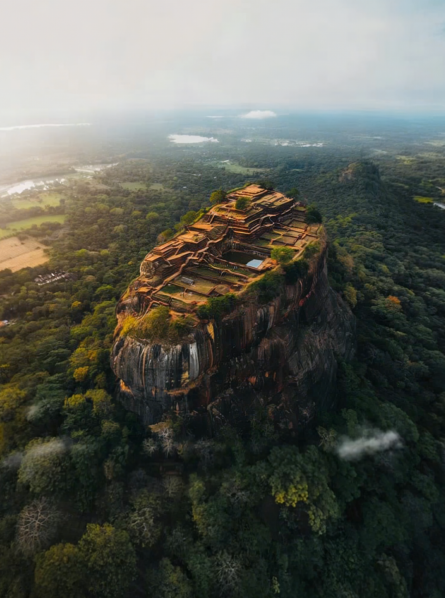 Explorer near a waterfall in Sri Lanka