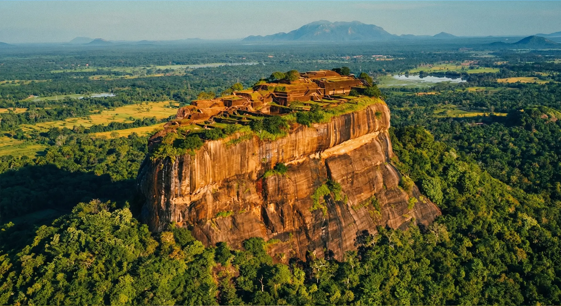 Sigiriya Rock Fortress rising above the Sri Lankan jungle, showing Lion Rock as a cultural and heritage landmark.