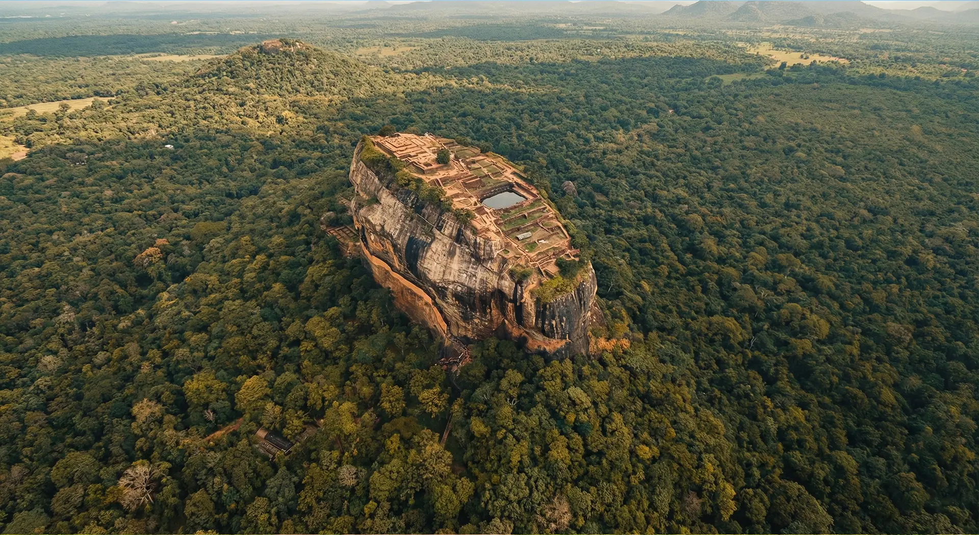 Aerial view of Sigiriya Rock Fortress and surrounding Cultural Triangle landscape on a tailor-made tour with TMR Travels.