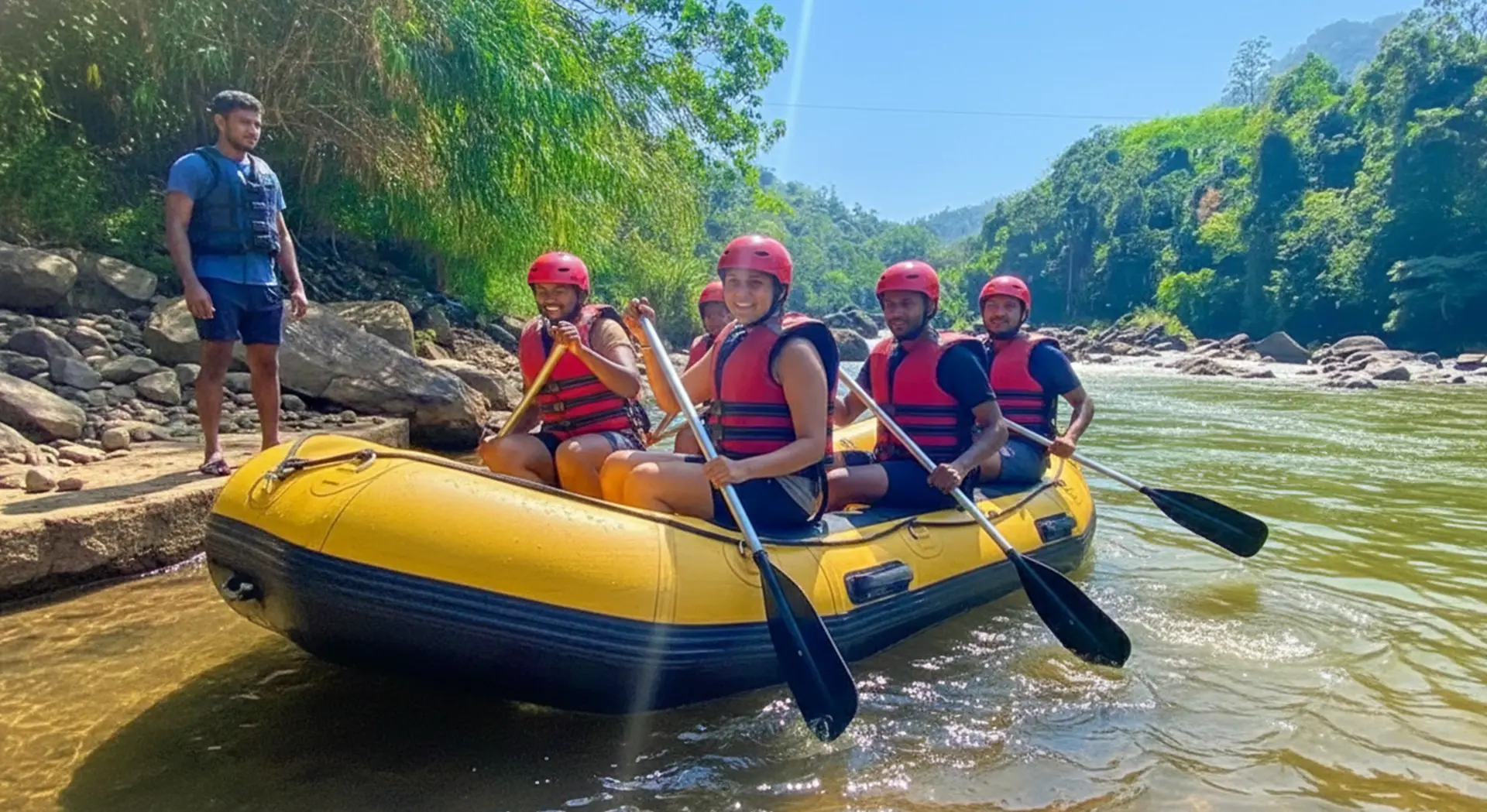 Inflatable raft navigating through white water rapids surrounded by lush green tropical jungle in Kitulgala.
